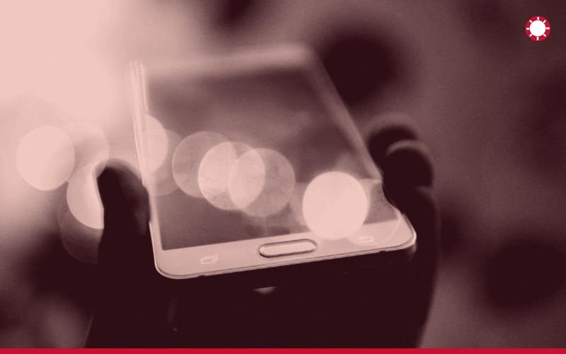 Phone in hand at night, minimum deposit casinos UK